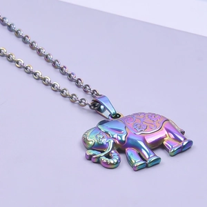 Macro shot of iridescent rainbow elephant pendant with matching metallic chain