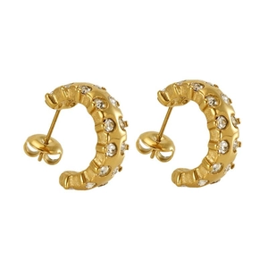 Golden C-shaped stainless steel earrings with textured surface and sparkling crystals