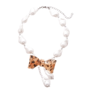 Baroque pearl necklace with leopard print bow pendant and silver lobster clasp detail
