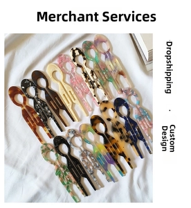 U-shaped acetate hair pins in various tortoiseshell and marble patterns on white fabric