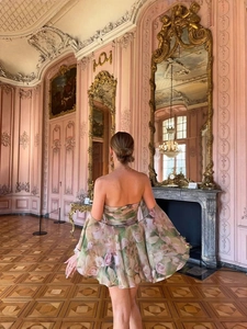 Floral chiffon tube dress with ruffle cape and rose print in a vintage luxury palace