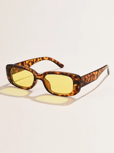 Detail view of vintage rectangle sunglasses with tortoise frame and yellow lenses