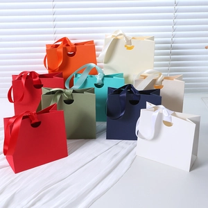 Premium colorful paper gift bags with silk satin handles for jewelry and luxury packaging