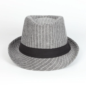 Detailed macro view showing the fine striped cotton fabric and black grosgrain ribbon of the hat