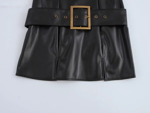 Detail of black PU leather skirt featuring a wide belt with vintage gold square buckle