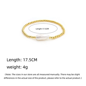 Macro view of baroque pearl bracelet with 18K gold beads showing weight and length