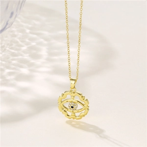 Vintage gold Turkish evil eye necklace with blue zircon and gear-shaped pendant charm