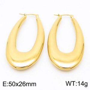 Detailed view of large gold U-shaped hollow earrings with 50x26mm size specifications