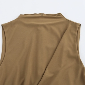 Detail view of khaki sleeveless dress featuring a high collar and hidden back zipper