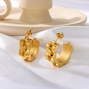 18k gold plated stainless steel hoop earrings with watch strap texture on silk