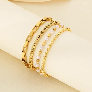 Set of four 18k gold plated stainless steel bracelets with chain and pearl textures