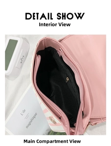 Internal view of pink striped crossbody bag with black fabric lining and zipper pocket