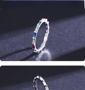 Vista macro di anelli in argento sterling arcobaleno con zirconi colorati