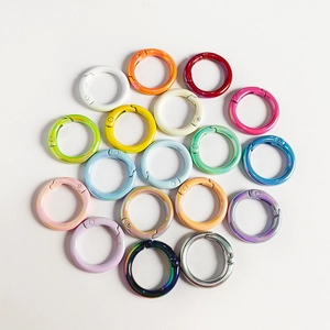 Detailed grid of colorful round alloy spring ring clasps for DIY jewelry making