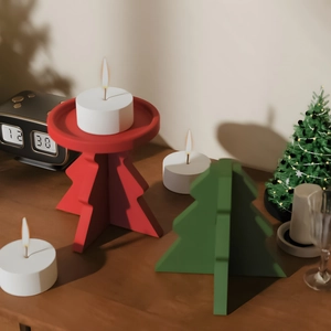 Detail of interlocking Christmas tree candle holder in red and green festive matte finish
