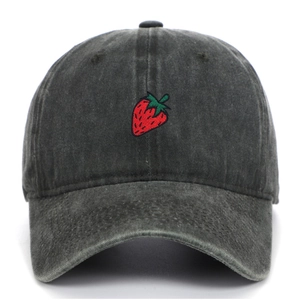 Close-up of strawberry embroidery detail on washed dark grey vintage cotton baseball cap