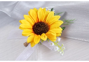 Detail view of sunflower boutonniere with small white flowers and hemp rope handle