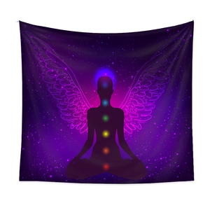 Detail of meditation tapestry showing seven chakras and glowing wings on starry background