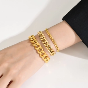 Three-piece golden stainless steel Cuban link bracelet set for women in stacked style