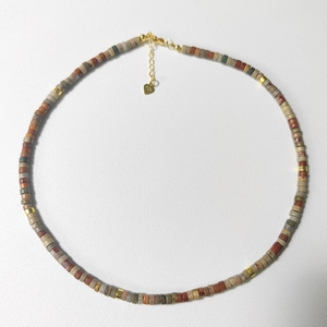 Macro view of multi-color natural stone beads necklace with S925 sterling silver tag