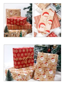 Detail of Christmas kraft wrapping paper featuring reindeer, snowflakes and festive patterns