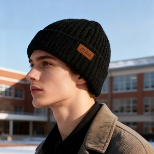Black ribbed knit winter beanie with NY&JA leather patch and thick fleece lining for warmth