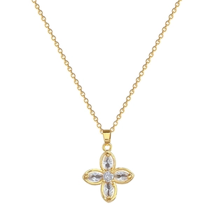 Luxurious gold clover necklace featuring sparkling clear crystals on a delicate chain