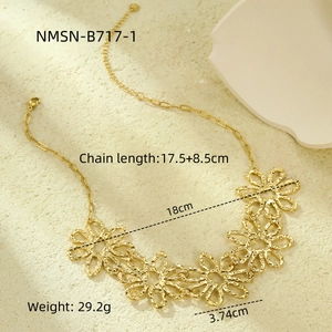 Elegant gold flower necklace with dimensions and chain length specs on beige background