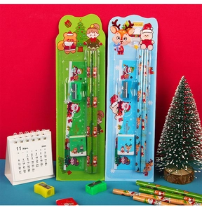 Detailed view of Christmas stationery sets with pencils, ruler and eraser in festive packaging