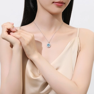 S925 sterling silver necklace with light blue oval stone and white diamonds on model