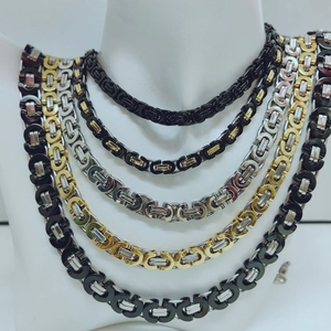 Detail showing various Byzantine style stainless steel chains in mixed color finishes