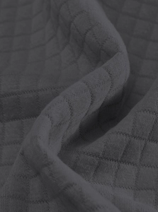 Close-up of deep gray knitted fabric with a distinct square quilted texture and fine pores