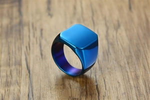 Macro detail of a square blue signet ring with polished metal and purple inner gradient