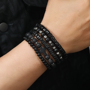 Men's multilayer beaded bracelet set featuring black wood beads, lava rock and cross charm