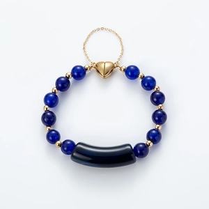Lapis lazuli beaded bracelet with gold heart magnetic clasp and black tube accent