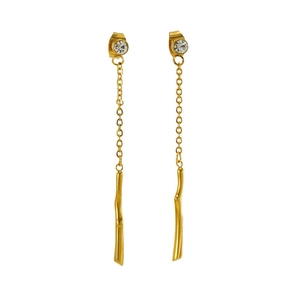 Detail of gold tassel earrings with crystal stud and long drop bar on white background