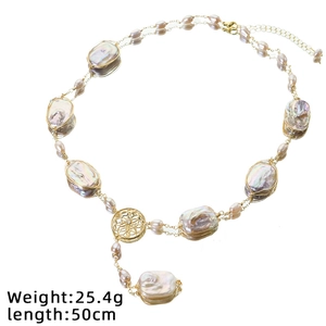 Baroque pearl necklace with purple gemstone in vintage gold wire-wrapped design