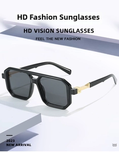 Detailed view of large black frame sunglasses with golden metal step-shaped side decoration