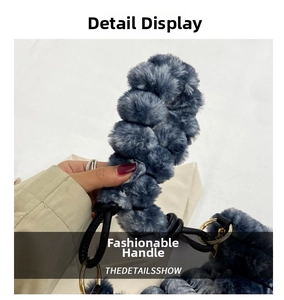 Detail of blue-grey plush handbag handle with golden metal ring and soft texture