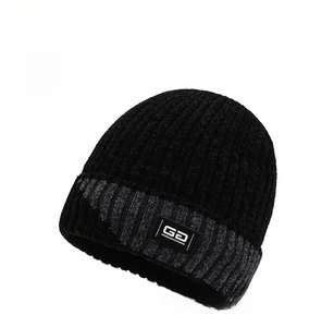 Detail of ribbed knit winter hat with black and gray stripes and GD letter patch