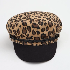 Detail of leopard print baker boy cap with black visor and braided cord decorative trim
