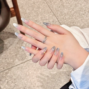 Gray-blue gradient cat eye press-on nails with luxury rhinestones and glitter finish