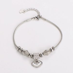 Detail showing snake chain bracelet with life lock charm and sparkling crystal bead