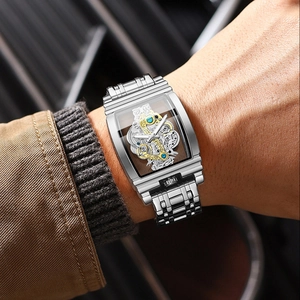 Men's silver tonneau skeleton mechanical watch with exposed gears and leather strap