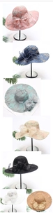 Detail of elegant lace sun hats with large bows in various colors for summer UV protection