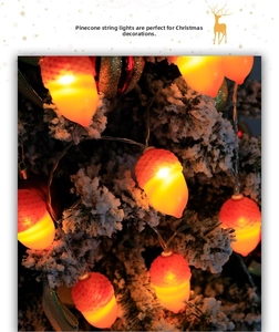 Close-up of LED pine cone string lights with warm glow on snow-covered Christmas tree branches