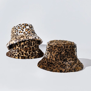 Plush leopard print bucket hats in gradient tones made of warm faux fur material