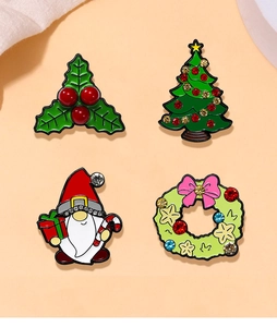 Detailed view of four colorful enamel Christmas brooches featuring rhinestone accents