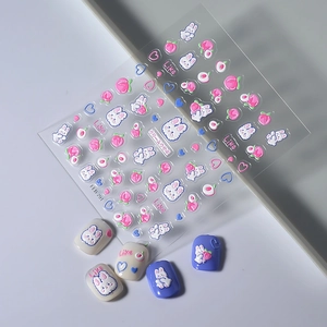 5D embossed nail art stickers featuring cute rabbits, peaches, and hearts on grey background