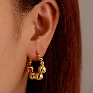 Minimalist gold beaded hoop earrings for women featuring graduated round polished spheres